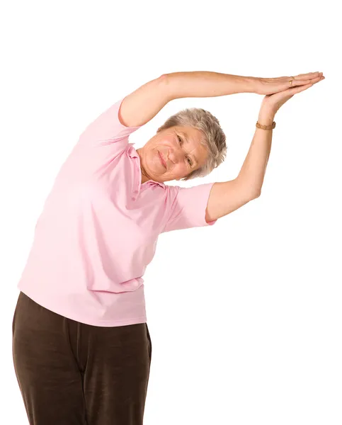 Зрелая женщина в положении йоги Стоковое Фото