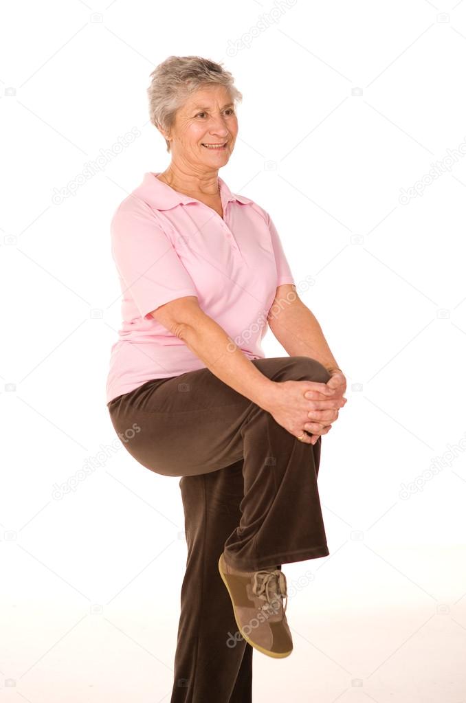 Mature older lady stretching