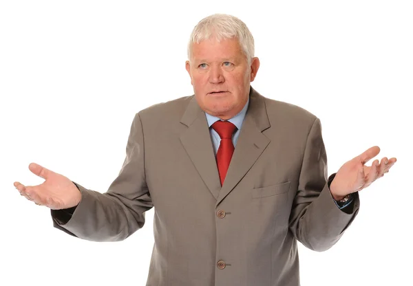 Successful mature businessman shrugging — Stock Photo, Image