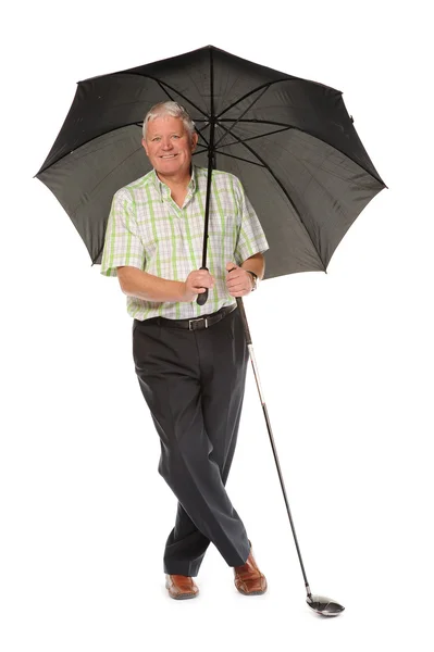 Šťastný příležitostné zralé golfista s deštníkem — Stock fotografie