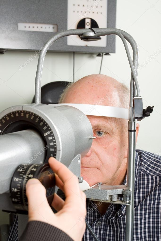 Older man having eye examination