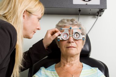 Lady having eye test examination clipart