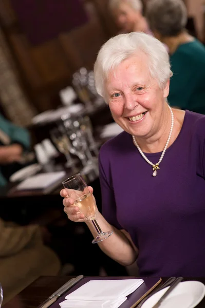 Happy senior lady in restaurant — Stock Photo, Image