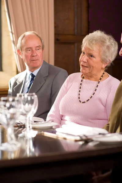 Older couples in restaurant Royalty Free Stock Photos