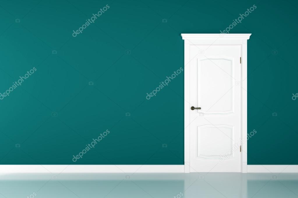 Closed white door on green wall