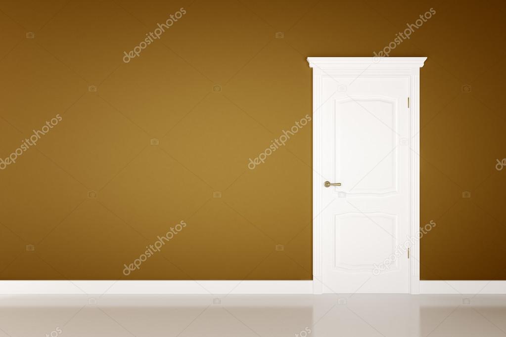 Closed white door on brown wall