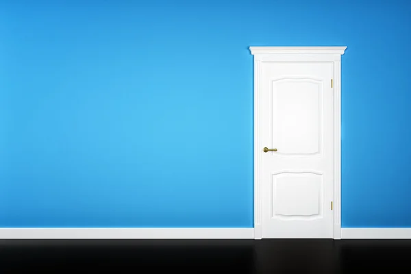 Closed white door on blue wall — Stock Photo, Image