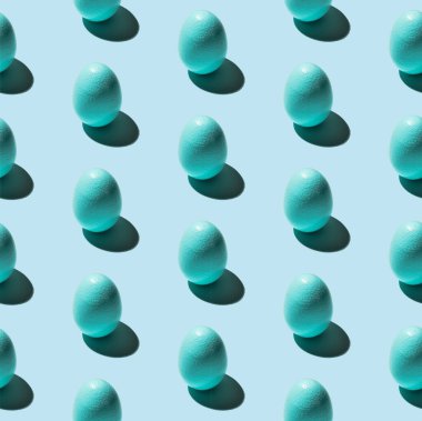 Mavi arkaplanda mavi yumurta deseni var. Paskalya