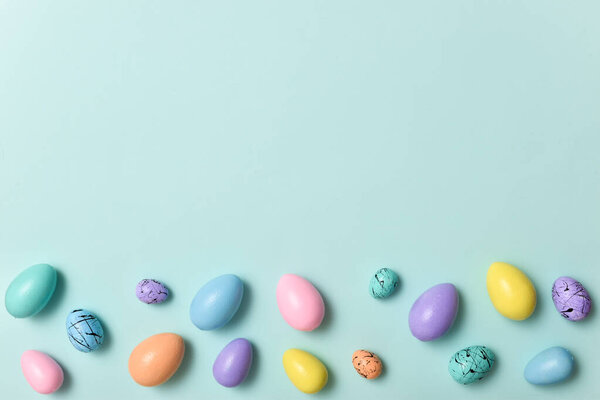 Easter postcard with bed-colored eggs with a copy of the place for the text. Banner for Easter. Festive background. Copy space. Flat lay, top view.