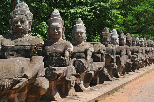 Giants Buddha Statues in Front South Gate of Angkor Tom Royalty Free Stock Photos