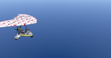 Ultra light aircraft glides through the sky