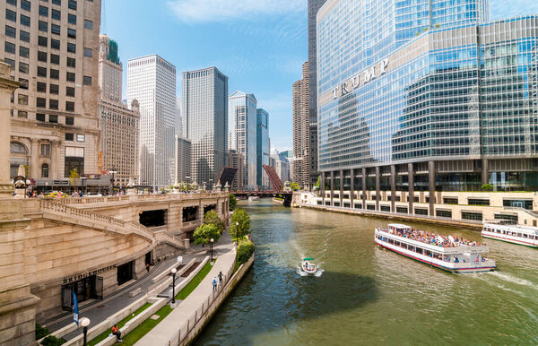 Chicago, Illinois, USA - August 24, 2014: View of Chicago River with skyscrapers and tourist boats, USA