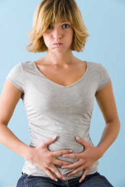 ABDOMINAL PAIN IN A WOMAN clipart
