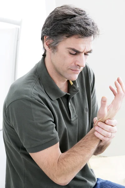 PAINFUL WRIST IN A MAN — Stock Photo, Image