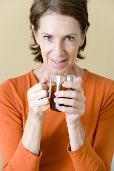 ELDERLY PERSON WITH HOT DRINK — Stock Photo, Image