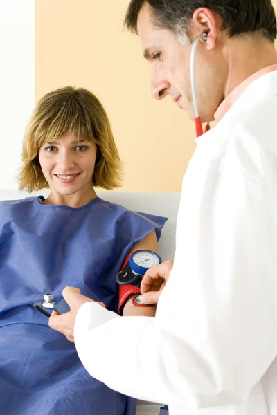 BLOOD PRESSURE, WOMAN — Stock Photo, Image