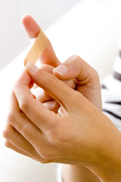 WOMAN with adhesive plaster — Stock Photo, Image
