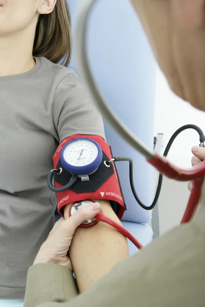 BLOOD PRESSURE, WOMAN — Stock Photo, Image