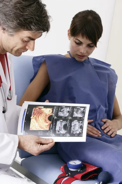 WOMAN AT HOSP. CONSULT. DIALOGUE — Stock Image WOMAN AT HOSP. CONSULT. DIALOGUE Royalty Free Stock Photos