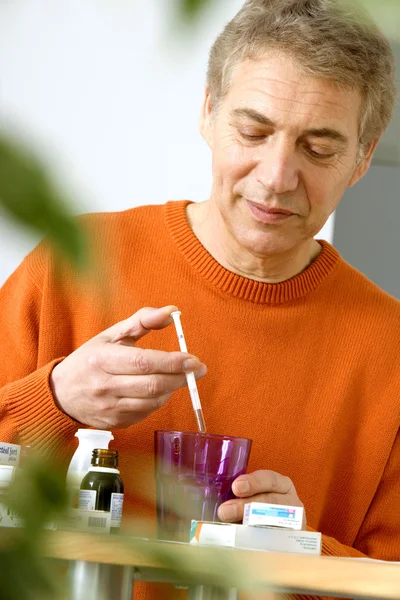 ELDERLY PERSON TAKING MEDICATION — Stock Photo, Image
