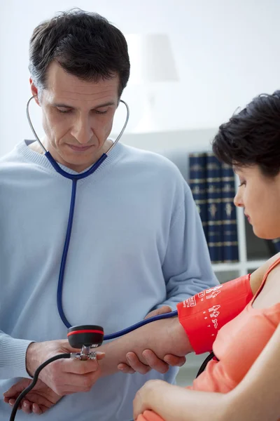 BLOOD PRESSURE, WOMAN — Stock Photo, Image