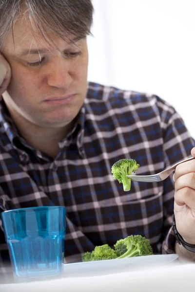 MAN EATING VEGETABLE — Stock Photo, Image