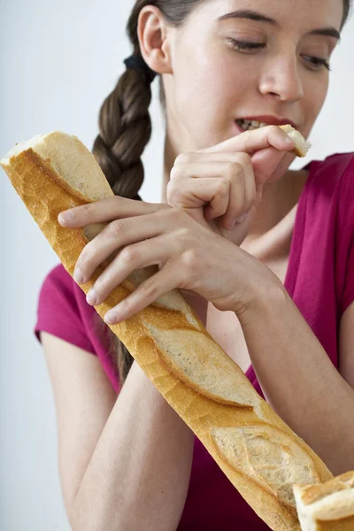 WOMAN EATING STARCHY FOOD Stock Image