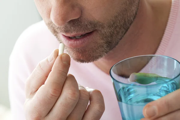 MAN TAKING MEDICATION — Stock Photo, Image