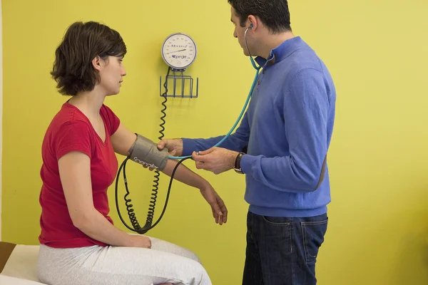 BLOOD PRESSURE, WOMAN — Stock Photo, Image