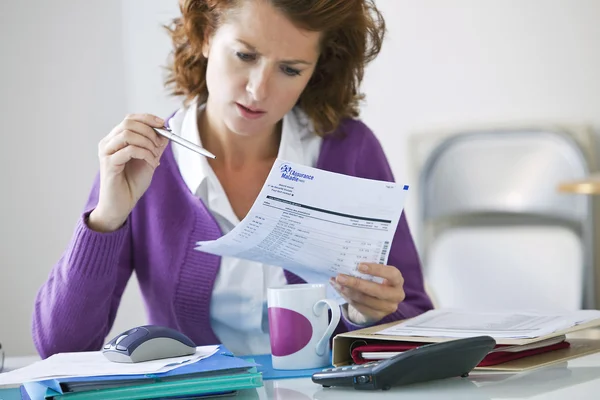 WOMAN DOING PAPERWORK — Stock Photo, Image