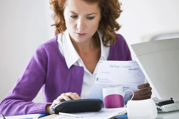 WOMAN DOING PAPERWORK — Stock Photo, Image