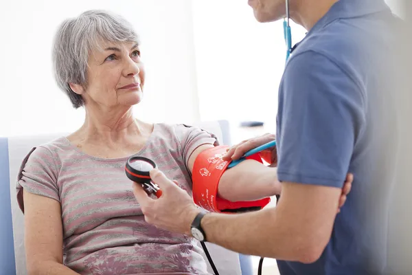 BLOOD PRESSURE, ELDERLY PERSON — Stock Photo, Image