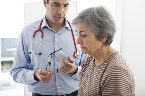 ELDERLY PERSON IN CONSULTATION — Stock Photo, Image