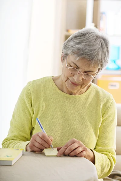 ELDERLY PERSON WRITING — Stock Photo, Image