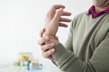 PAINFUL WRIST IN A MAN clipart