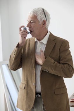 Man makes inhaled asthma clipart