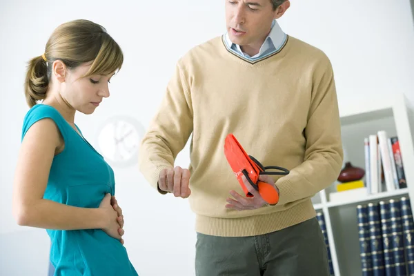 CONSULTATION, WOMAN IN PAIN — Stock Photo, Image