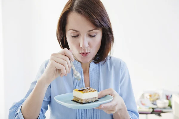 WOMAN EATING SWEETS — Stock Photo, Image