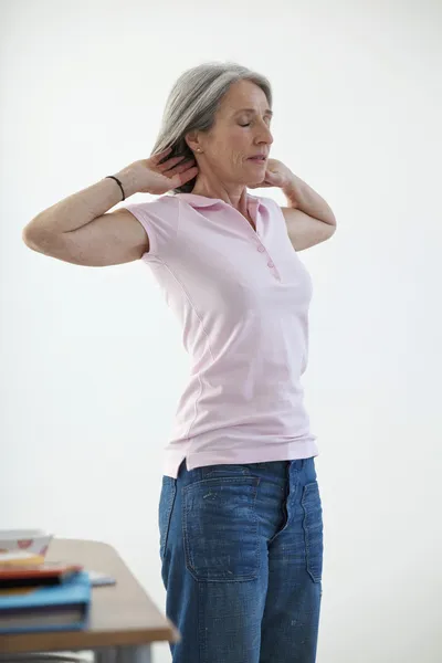 ELDERLY PERSON STRETCHING — Stock Photo, Image