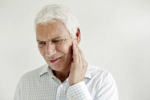 ELDERLY PERSON WITH A TOOTHACHE — Stock Photo, Image