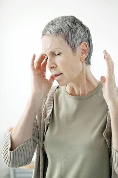 ELDERLY PERSON WITH HEADACHE — Stock Photo, Image