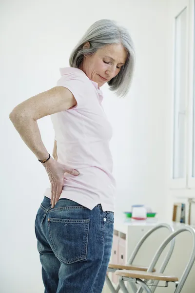 LOWER BACK PAIN IN ELDERLY PERS. Royalty Free Stock Images