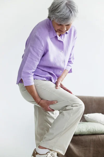 LEG PAIN IN AN ELDERLY PERSON Stock Picture