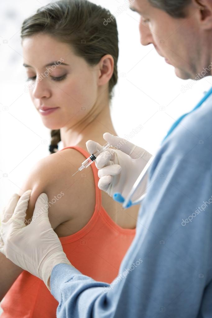 VACCINATING A WOMAN