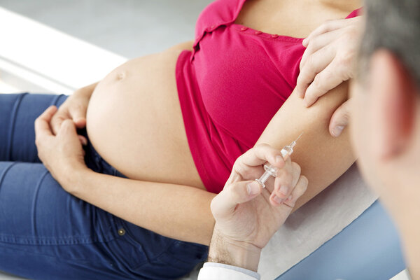 VACCINATING A PREGNANT WOMAN