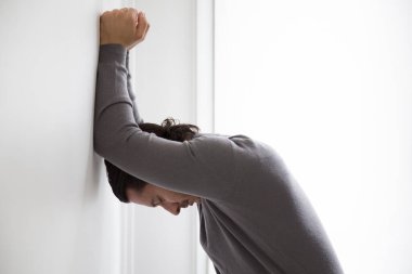 Depressed man on studio background