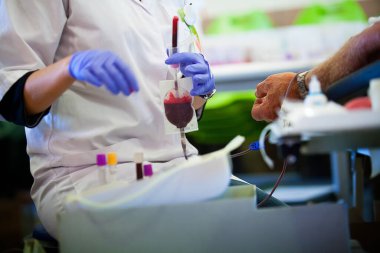 Blood donor in a blood collection facility.