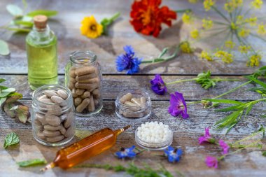 Alternative herb medicine. herbal vitamin on wooden board