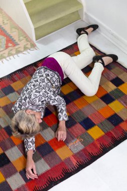 Elderly woman who has fallen down stairs.