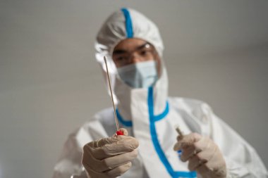 Medical personnel performing an antigen test for covid-19.